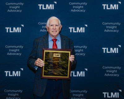 Online Labels Group founder, Joel Carmany, holding the Eugene Singer Award.